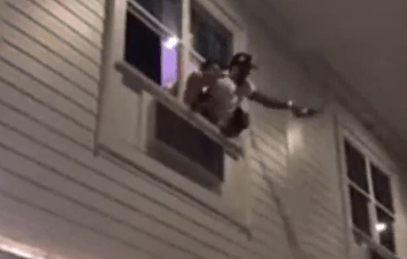 This may or may not be Johnny Manziel and Josh Gordon pouring beer off of a balcony