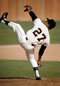 Portrait of Juan Marichal of the San Francisco Giants while pitching during a spring training photo shoot at the Francisco Grande resort.  Casa Grande, Arizona 3/8/1965 (Image # 1073 )