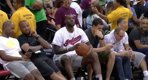 LeBron (wearing an Indians jersey) nonchalantly drills a shot from 40 feet sitting on the sideline